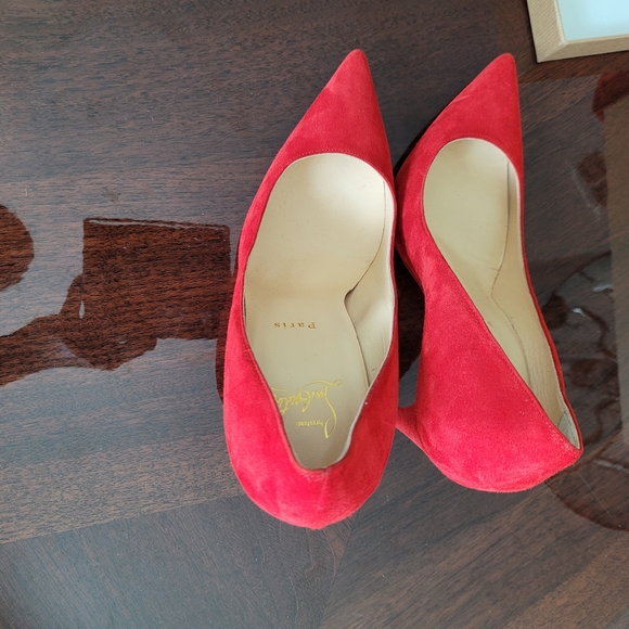 Christian Louboutin red pumps